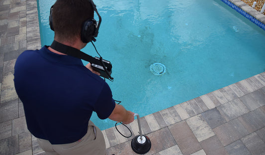 Pool Leak Detection specialist listening for leaks with an Aquatic Amplifier